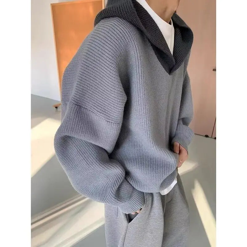 Model wearing a high end retro hoodie in gray, showcasing style and comfort for modern women's fashion.