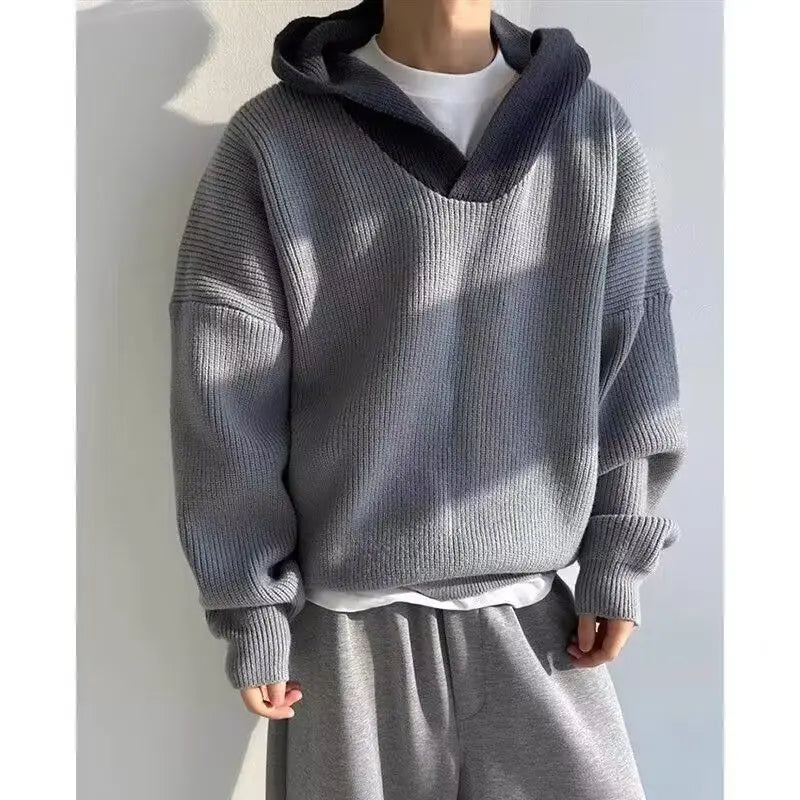 Model wearing a high end retro hoodie in gray, showcasing style and comfort for modern women's fashion.