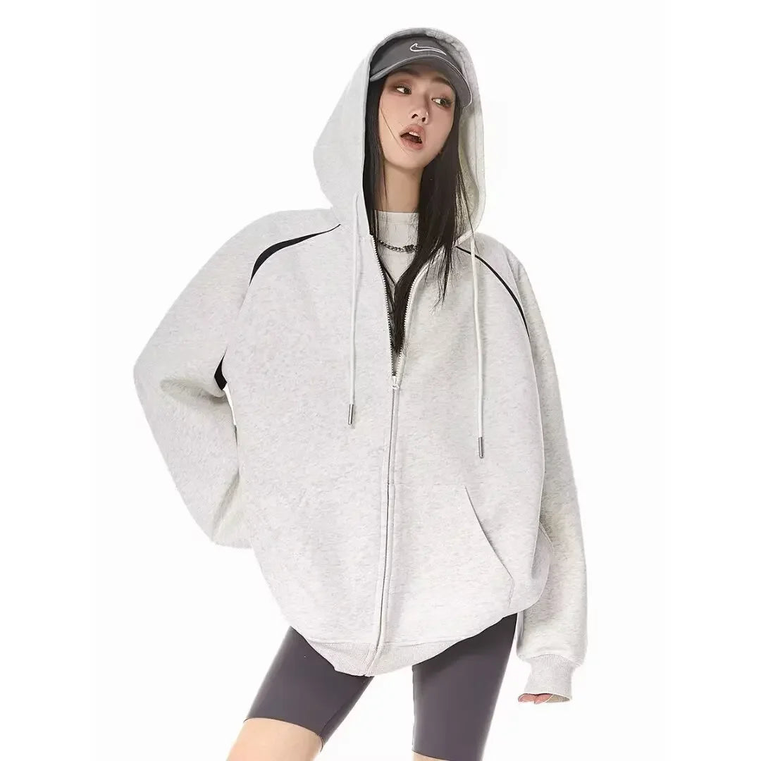 Women wearing a stylish burgundy women's autumn winter hoodie 2025 with a zipper, perfect for casual outings.
