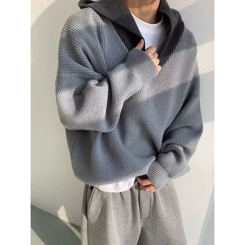Model wearing a high end retro hoodie in gray, showcasing style and comfort for modern women's fashion.