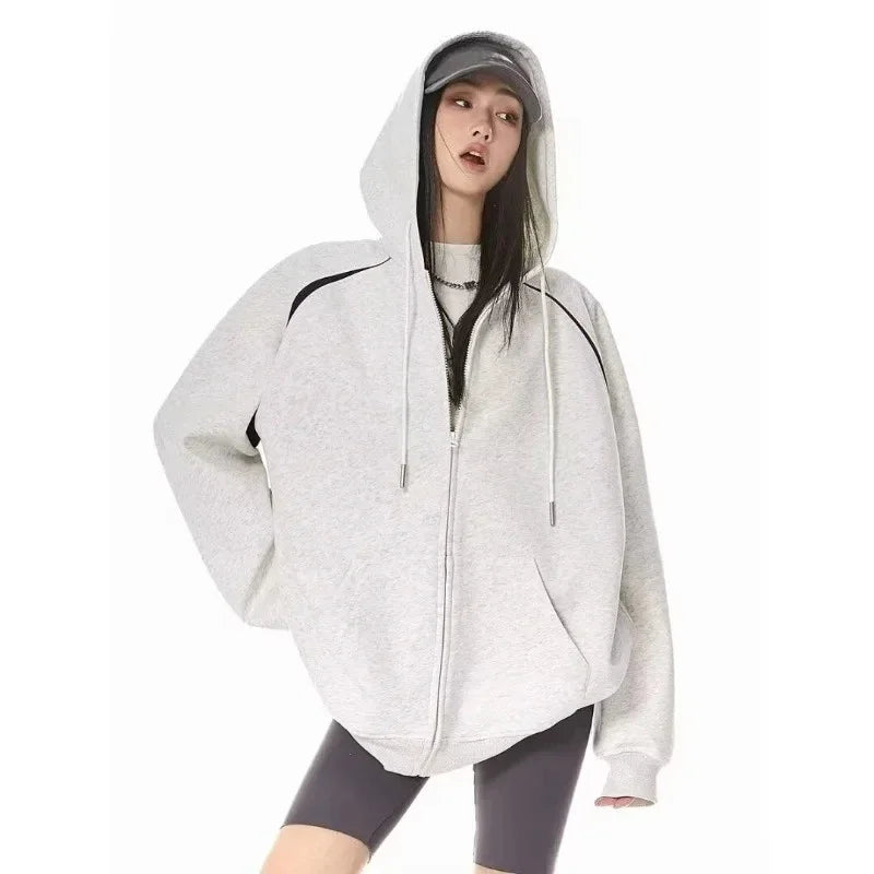 Women wearing a stylish burgundy women's autumn winter hoodie 2025 with a zipper, perfect for casual outings.