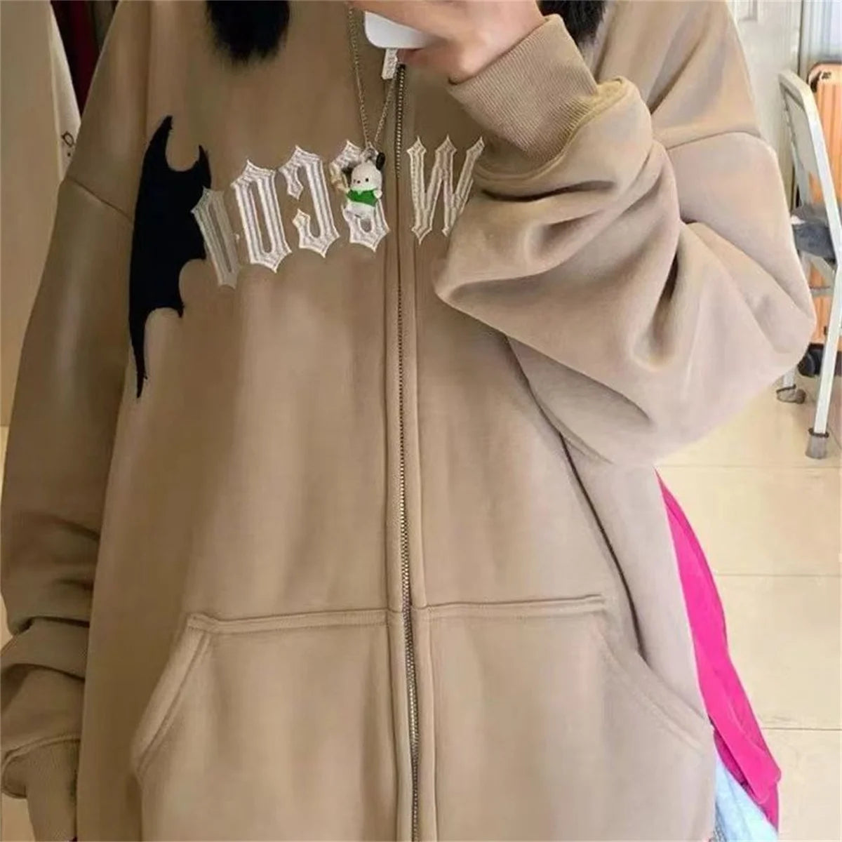 Evil Horns Hoodies Women showcasing a stylish hooded design with unique horn details on the back, perfect for casual wear.