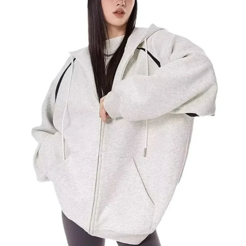 Women wearing a stylish burgundy women's autumn winter hoodie 2025 with a zipper, perfect for casual outings.