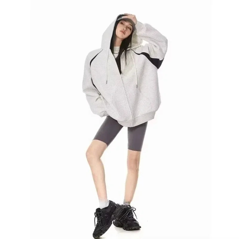 Women wearing a stylish burgundy women's autumn winter hoodie 2025 with a zipper, perfect for casual outings.