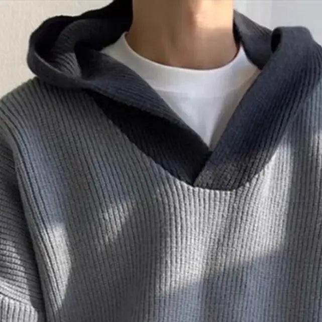 Model wearing a high end retro hoodie in gray, showcasing style and comfort for modern women's fashion.