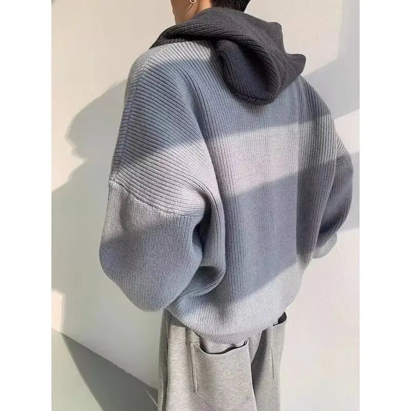 Model wearing a high end retro hoodie in gray, showcasing style and comfort for modern women's fashion.
