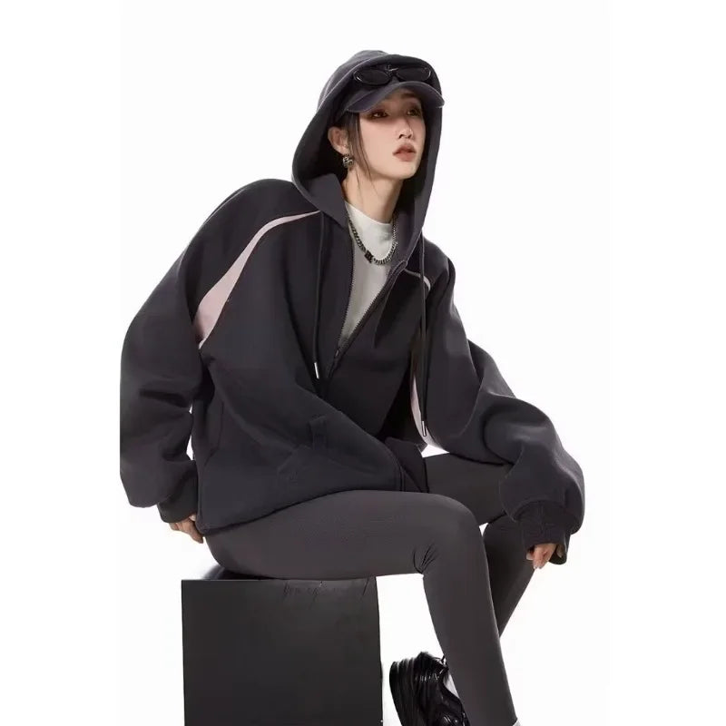 Women wearing a stylish burgundy women's autumn winter hoodie 2025 with a zipper, perfect for casual outings.